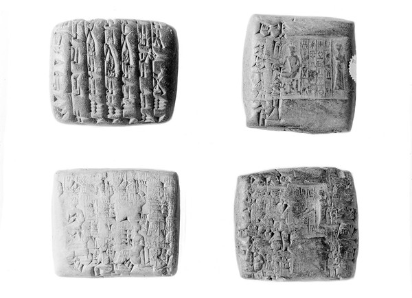 Four Persian slates, reverse and obverse.