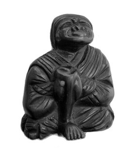 Wood man, right shin, Moxa. From Doctor Gunther's collection of Netsuke.