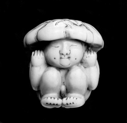 Ivory new born child in the state of flexion.