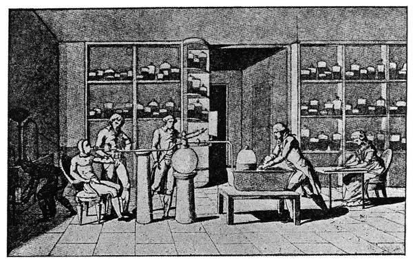 Lavoisier in his laboratory conducting an experiment on the respiration of a man resting. Photogravure after M.A.P. Lavoisier.