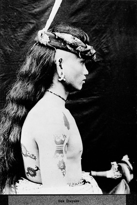 Sea Dayaks, a half-length male figure with long hair