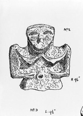 Female image on Charm, carved from a piece of coal