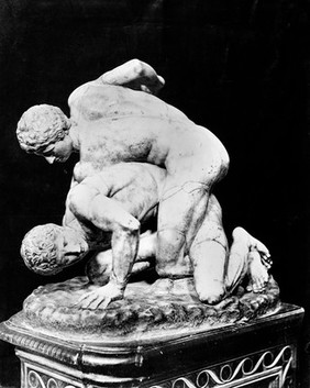 Antique sculpture of wrestlers.