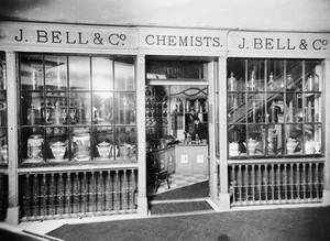 view Original shop front of John Bell & Company (chemists), 225 Oxford Street, London. Almost full front view of shop, door open showing interior