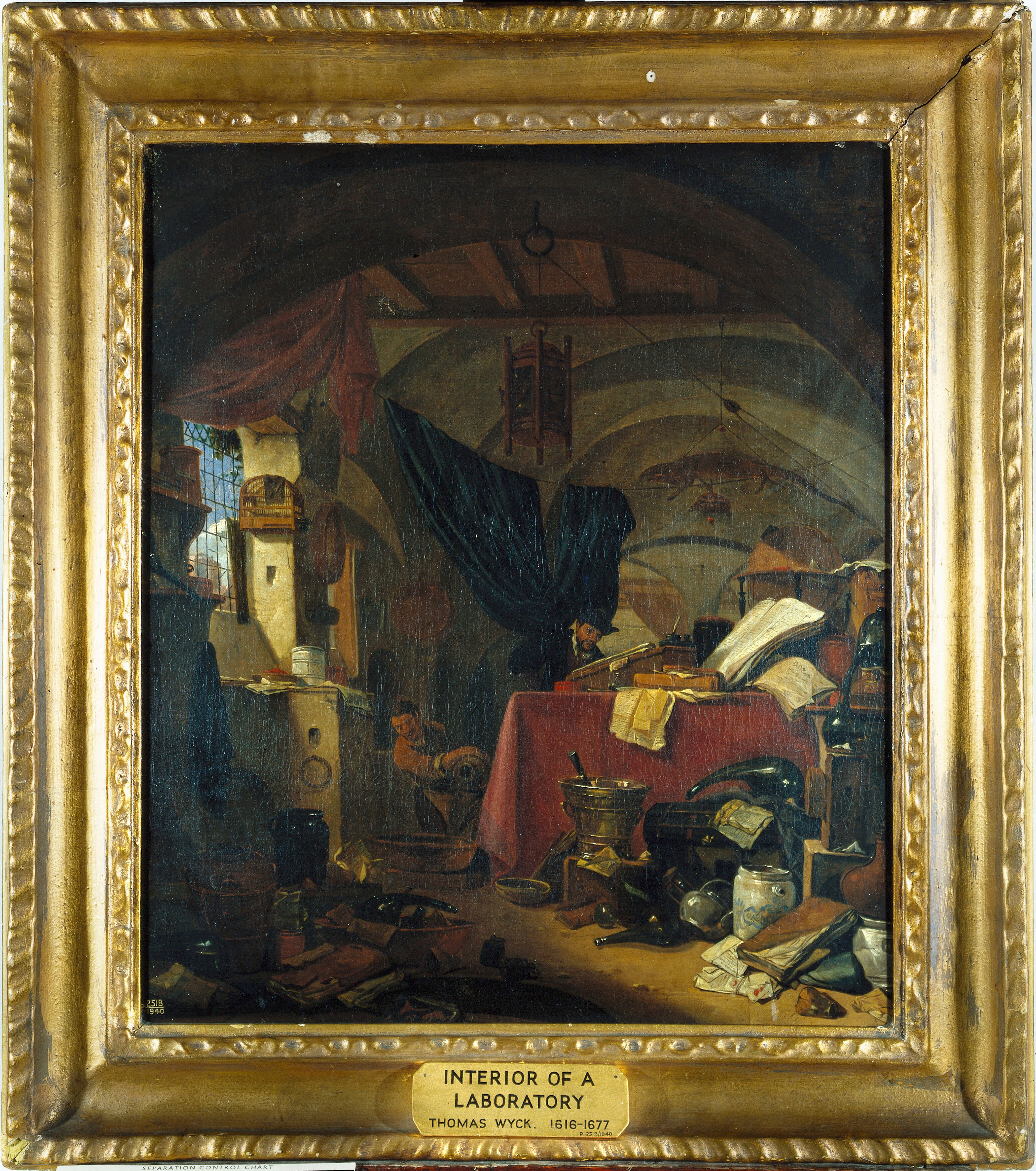 Interior With An Alchemist Studying A Book His Assistant Pouring