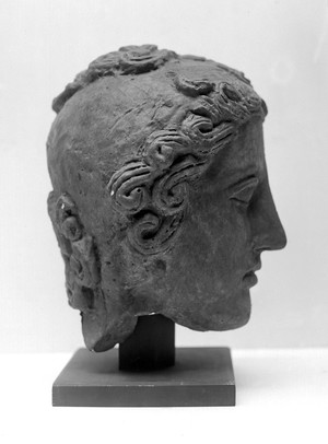 view Ex-voto: head of boy showing ring worm. Cast of original in Museum Campidoglio, Rome. Profile.