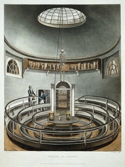 A sky-lit anatomy theatre with anatomical specimens in jars and a suspended skeleton. Colour acquatint by J. C. Stadler after A. Pugin, 1815.