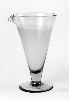 Original apparatus belonging to Marie Curie, glass beaker that contained the first solution of radium salts (note discolourisation of glass)