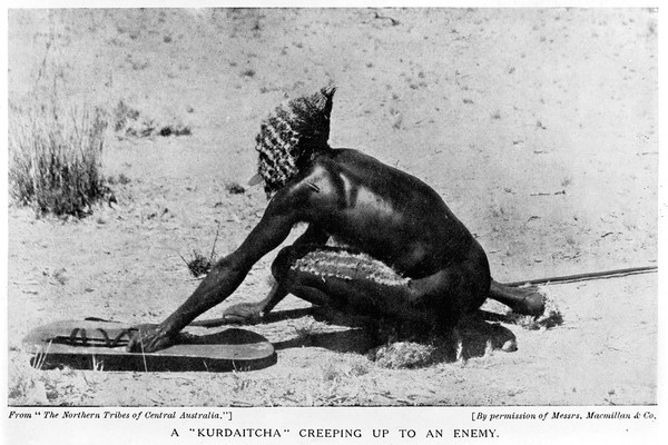 Man wearing 'Kurdaitcha' equipment. Central Australia.