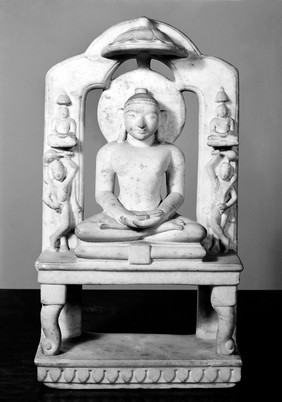 Marble Jain seated-figure with crossed hands and feet.