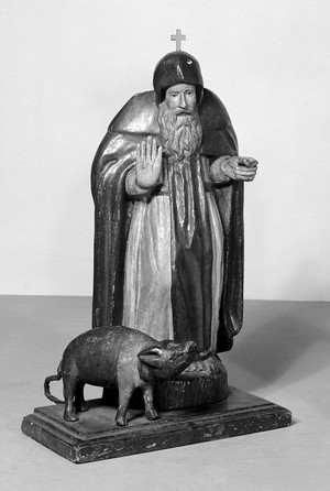 view Saint Anthony, with emblem; a pig and carrying box.