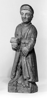 Statue of Saint Adrien (St. Drien, Finisterre). Emblem: holding his entrails. Invoked against intestinal ailments and from 12th century onwards against the plague.