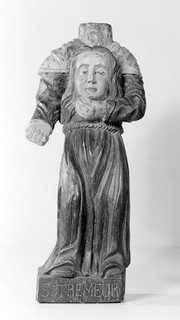 Saint Tremeur, a 6th century Breton saint, who was murdered, whilst still a youth, in the monastery of Rhugs (Morbihan) by his father. He has been invoked, even in England, since the 7th century. Invoked for head pains. Represented carrying his head.