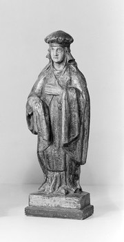 Statue of Saint of Damian represented with pestle and mortar.