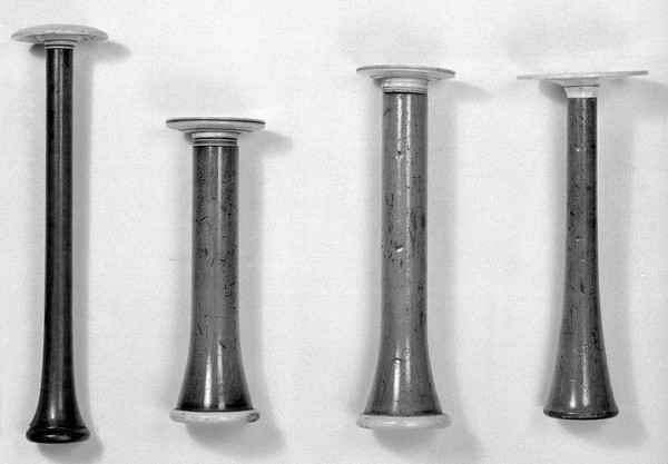 Stethoscopes. A- perhaps Stoke's type with ivory ear plate. B, C, D, -probably all English versions of the Piorry stethoscope dating from 1830s to 1840s.