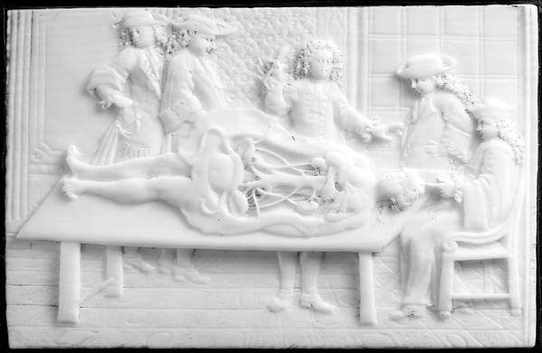 A demonstration in anatomy, carved ivory plaque