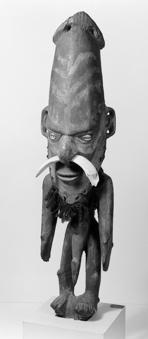 view Anthropomorphic flute ornament - male effigy, New Guinea.