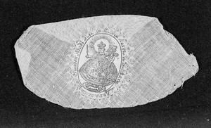 view Fraisenhendchen or Lorettohemdchen; amulet. Image printed on silk and attached to a piece of gauze with cross-stitch.