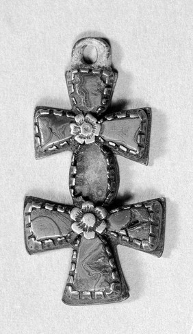 Wehen Kreuz, double cross, two crosses with equal arms, but one arm is common tothem both. Silver inlaid with malachite. Worn during labour.