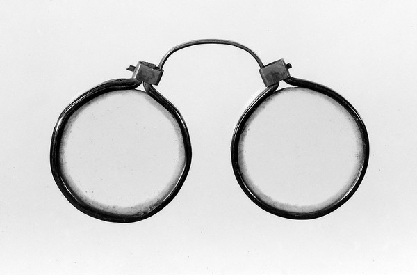 Eye-glasses. Horn-rims, copper bridge.