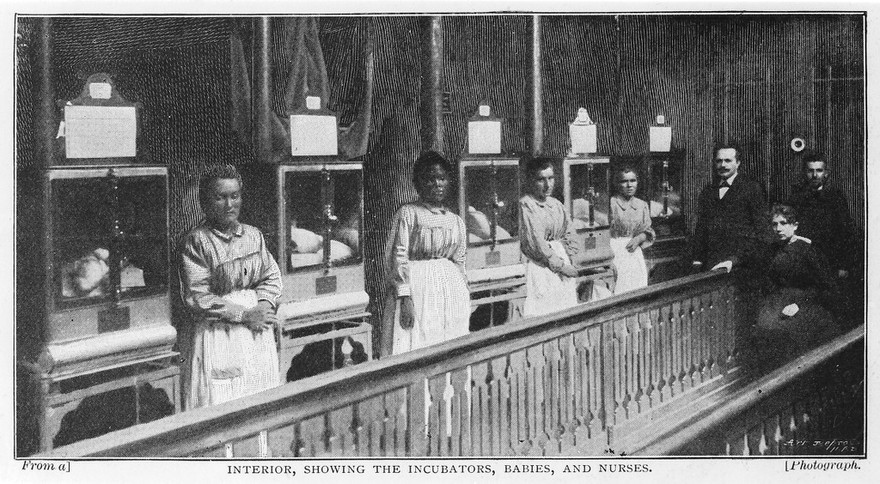 M0017257: Row of Lion incubators for babies, with nurses standing next to them, 1896