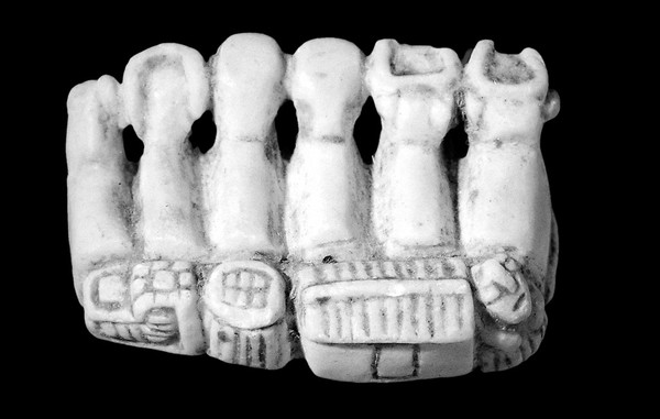 Amuletic objects of stone to ensure fertility, Bolivia. In the form of a group of animals. Photographed to show the top of the group.