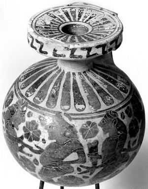 view Round aryballos, late Corinthian, showing 6 padded dancer (5 red-faced, 1 black-faced) and siren