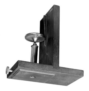 view Microtome used in the 1850's. It was introduced by C.M. Topping, a famous preparer of microscope slides in the 1840's. It came into general use in the 1850's. The thickness of section was controlled by the micrometer screw.