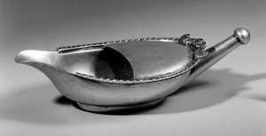 view Pap boat in silver with a pierced nipple spout at one end.