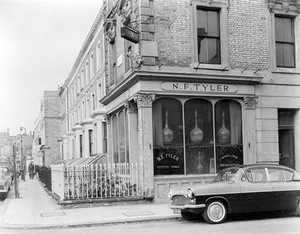 view Late 19th century chemist's shop formerly owned by N.F. Tyler. At 87 Abingdon Road, Kensington W 8. Photograph by Mr Michieli showing the exterior.