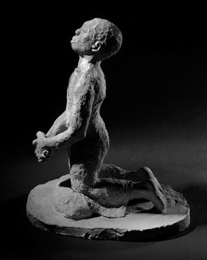 view Terracotta representation of a kneeling peasant, Africa.