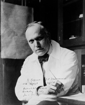 Portrait of Herbert M. Evans in laboratory, with signed inscription to J. C. Drummond, 11 January 1927