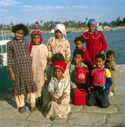 El-Amarna, Egypt; village children collecting water