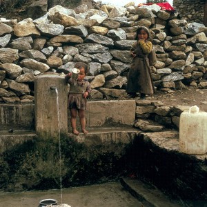 view Nepal; Sherpa children at a water pipe, 1986