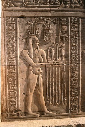 view Wall relief of a male with a paunch and pendulous breasts