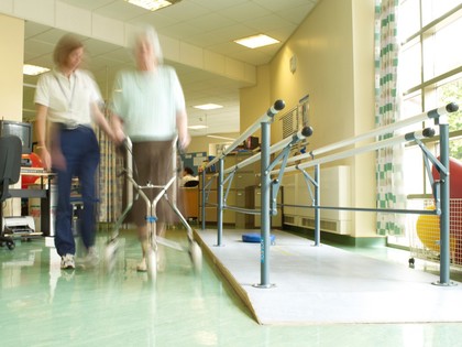 Female physiotherapist with elderly female patient