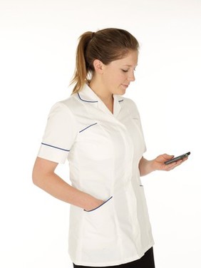 Young white female health professional in uniform with mobile