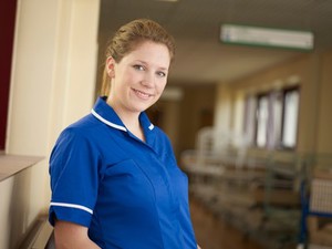 view Young female health professional in uniform