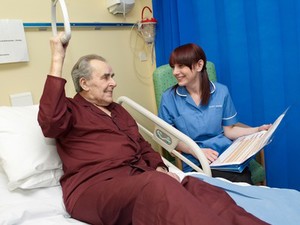 view A nurse carrying out observations on a patient