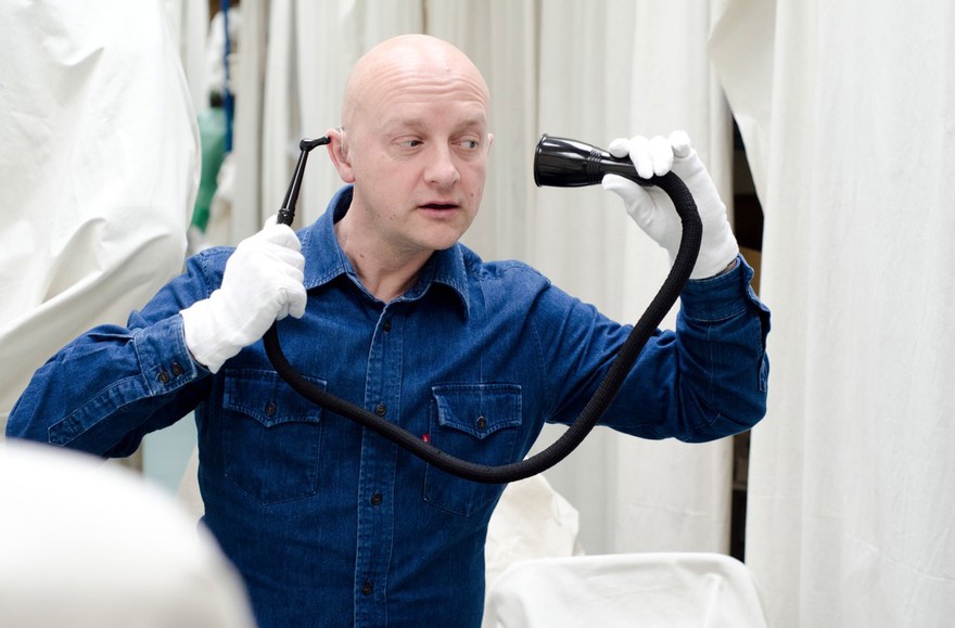 Mark Smith with historical and contemporary hearing aids