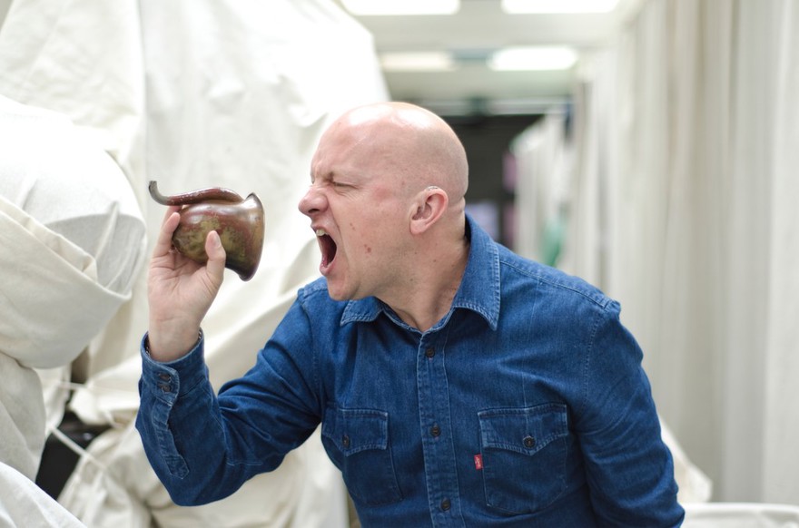 Mark Smith with historical and contemporary hearing aids
