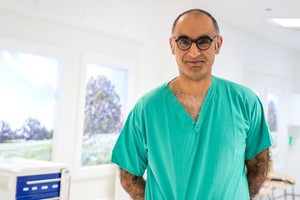 view Consultant surgeon in scrubs