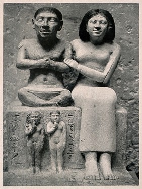 Seneb, a dwarf with his family. Reproduction, 1934, of a photograph of a statue.