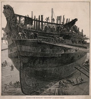 H.M.S. Dreadnought, a hospital ship, being broken up for salvage at Chatham Naval Dockyard, Kent. Wood engraving, 1875.
