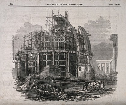 The British Museum: the reading room under construction. Wood engraving by J. Brown after C. W. Sheeres, 1855.