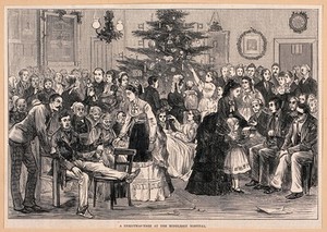 view The Middlesex Hospital: a party in a ward, with a Christmas tree and other decorations. Wood engraving, 1874.