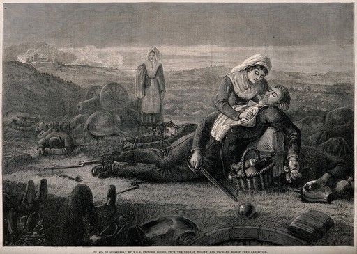 Franco-Prussian War: two nurses treating a soldier on the battlefield; part of an exhibition from the german widows' and orphans fund. Wood engraving by W. Hollidge.