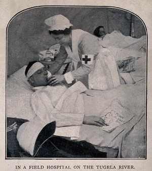view Boer War: a nurse lifts the head of a wounded man lying in a hospital ward. Halftone, c.1900.