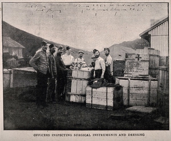 Boer War: soldiers checking the contents of crates of medical supplies. Halftone, c.1900.