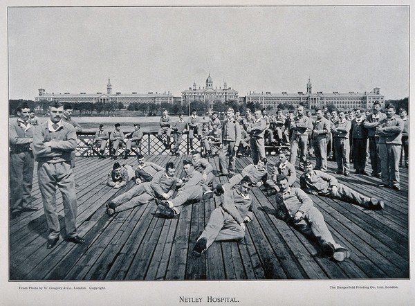 Boer War: soldiers relaxing by Southampton Water with a view across the estuary to Netley Hospital. Halftone after a photograph by W. Gregory & Co., London.